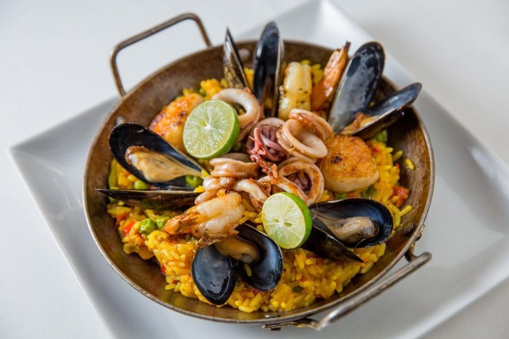 Seafood paella at Fig & Olive represents the flavors of Spain. 