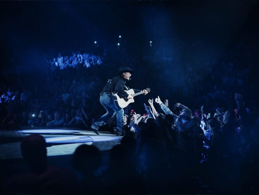 Garth Brooks Pulls Off Rock Star Moves at Rodeo, Uses Surprise Guest to Shock Record Crowd: Brooks is no George Strait, But he Has Plenty of Springsteen in Him