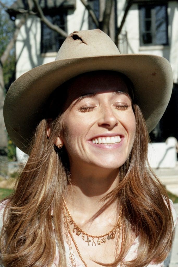 Soaking up the good vibes from a favorite Madison McKinley charm necklace and her great-grandfather's hat - a treasured family heirloom (photo by Tony Krash)