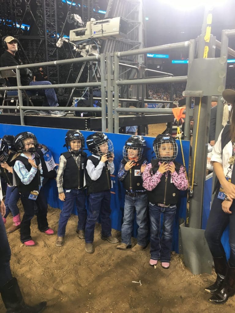 The children test the dirt of the competition floor.  