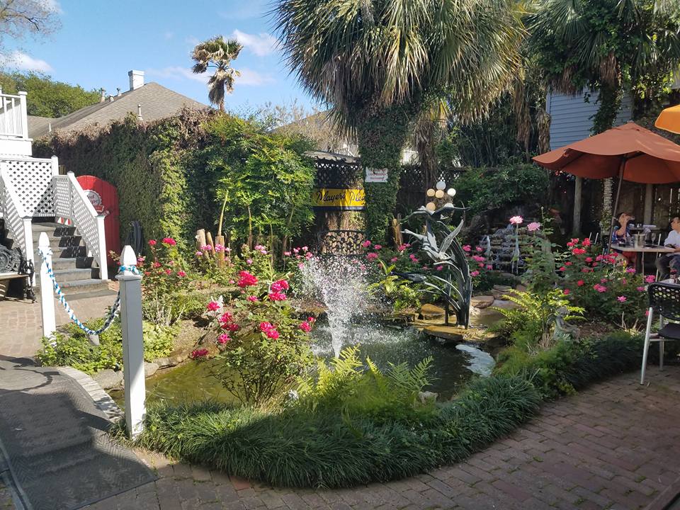Baba Yega's immaculate landscaping includes ponds, waterfalls and lush flower beds. (Photo from Baba Yega Cafe's Facebook.)