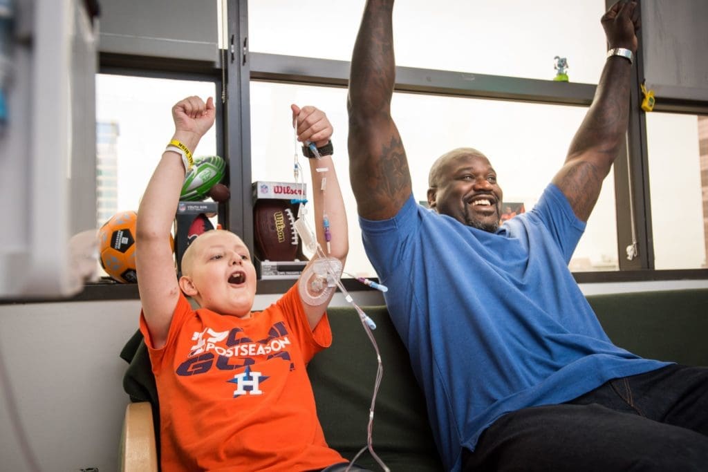 Shaquille O'Neal and Matt Iseman brighten the afternoon for patients at Texas Children's Cancer Center.