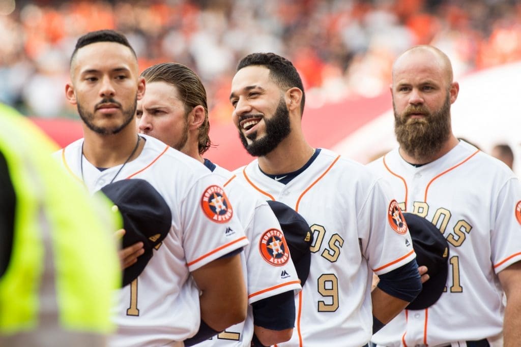 The Houston Astros line up before the home opener against the Orioles.