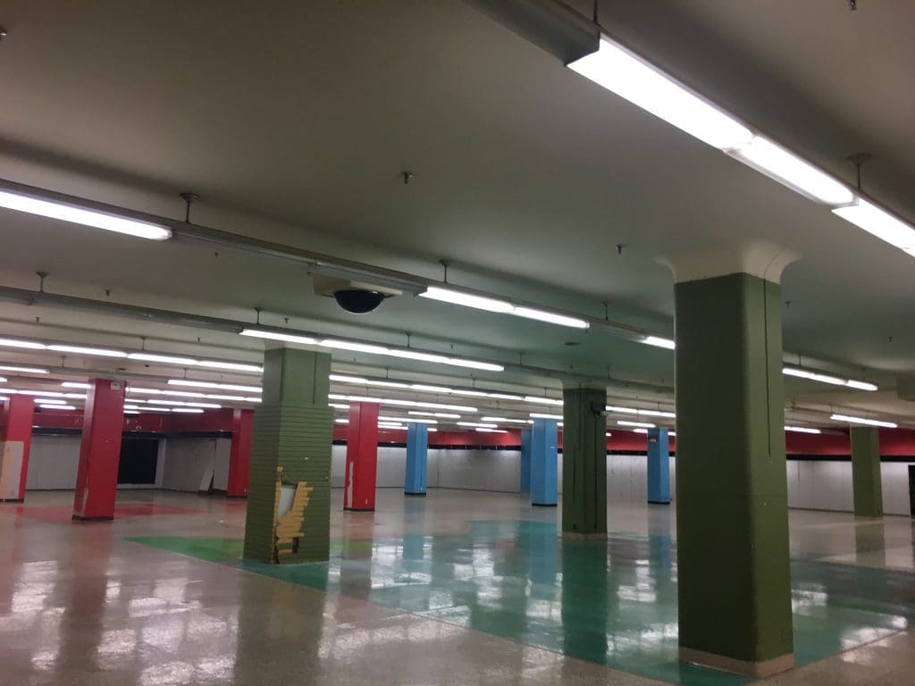 The higher floor has vestiges of its cheery, colorful former life. 