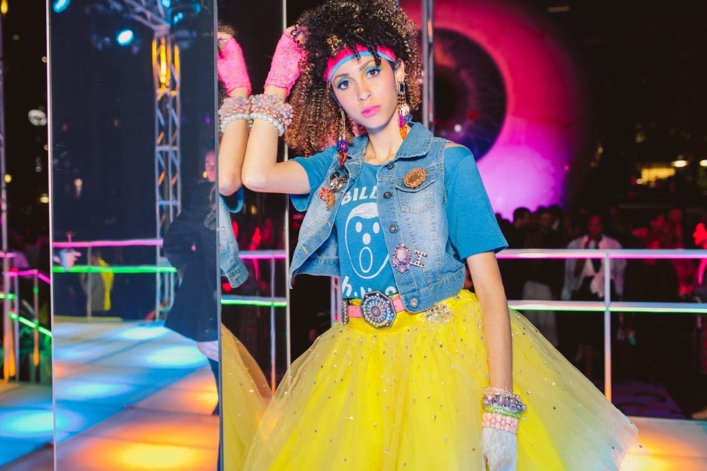 Models dressed in '80s costumes mingled throughout the party.