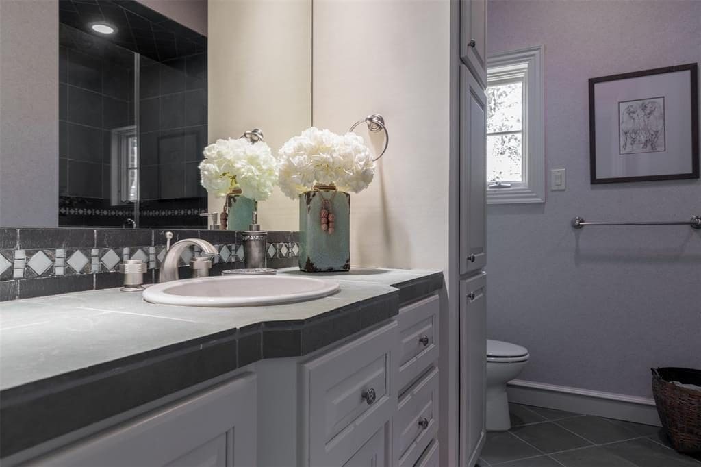 Slate tile counter tops add a nice touch to the second full bath. 