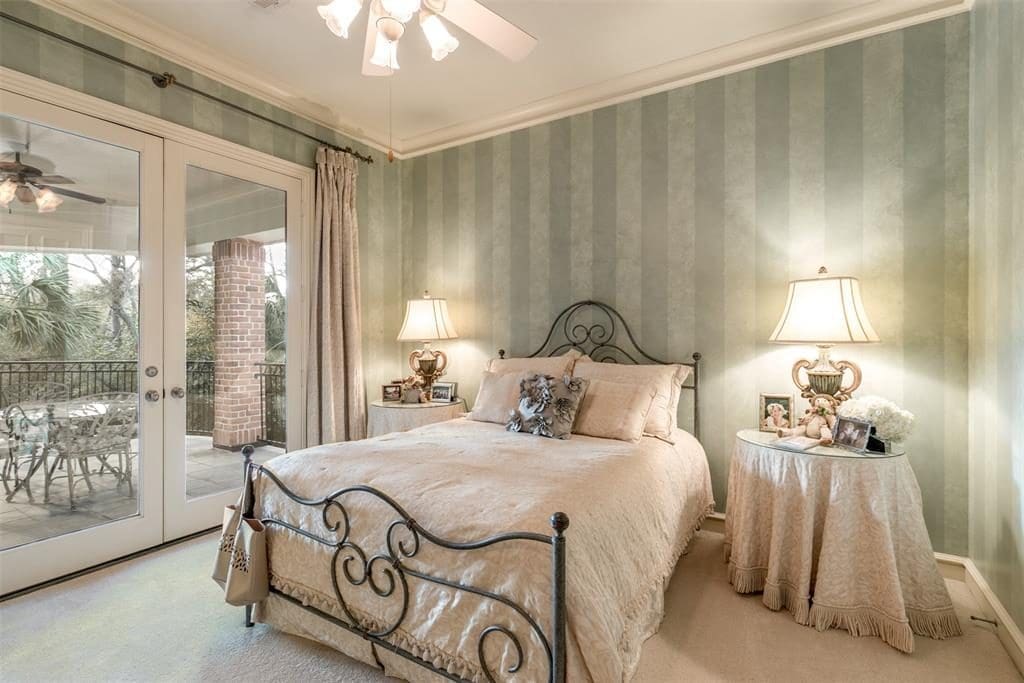 Double doors open up to the upper balcony outside the third bedroom. 
