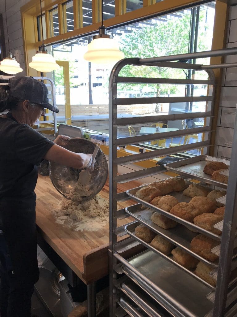 You can watch as biscuits are kneaded and made fresh daily at Dallas' The Biscuit Bar.