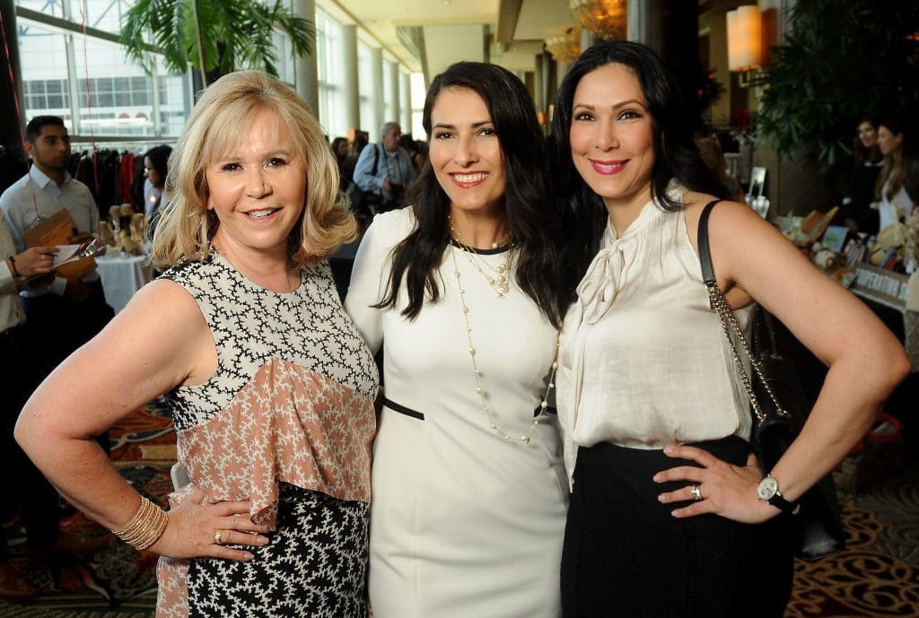 From left: Cyndy Garza Roberts, Maria Nelly Noble and Naimeh Salem at the Latin Women's Initiative Annual Fashion Show & Luncheon at the Hilton Americas Hotel Friday  May 11 ,2018.(Dave Rossman Photo)