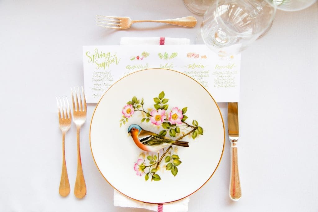 Each place setting featured a different vintage plate procured by Goodie Rentals in Round Top and a watercolor menu by Nancy Bihlmaier of Nancy B. Creative.