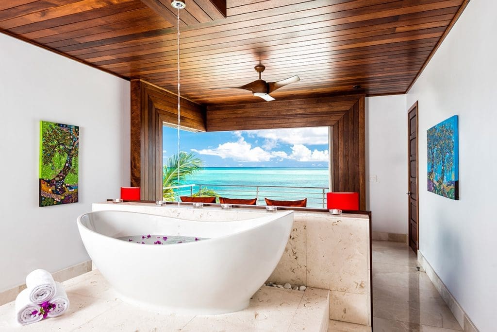 Take in the sea as you settle in for a nice warm soak in Turks & Caicos' Beach Kandi villa. 