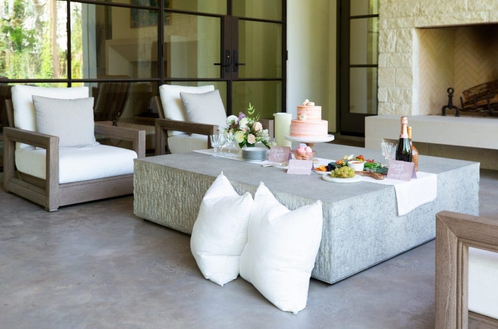 Cocktails and light bites were enjoyed on the terrace in a Bellaire home designed by Marie Flanigan Interiors