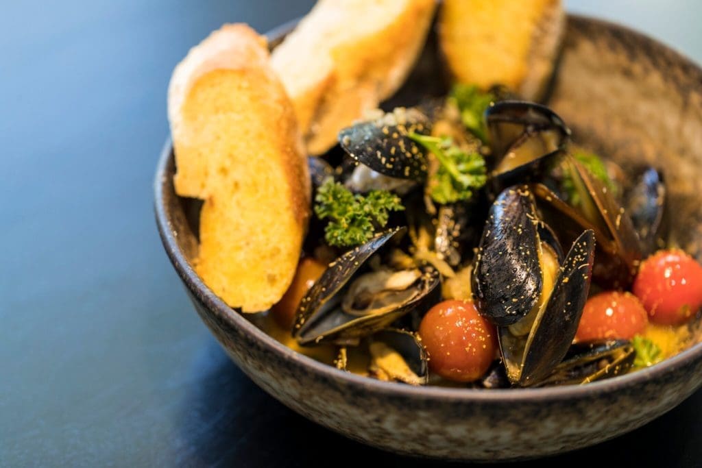Poitin's dishes will have influences from all over the world, like this Mussels a la Plancha. 