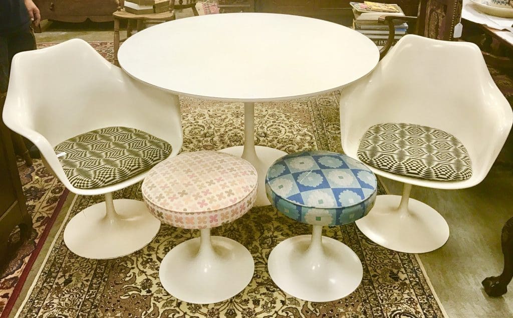 Eero Saarinen's tulip chairs, stools, and table for Herman Miller, from the collection of Rosmarin, a devotee of design as well as fashion and art. 