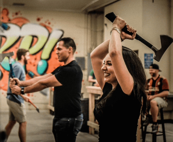 Wind up, as professional demonstrate appropriate axe throwing technique; photo courtesy of Bad Axe Throwing