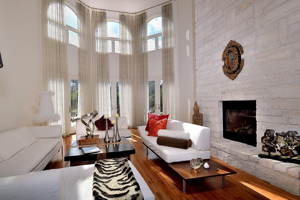 The den boasts one of the three fire places. 