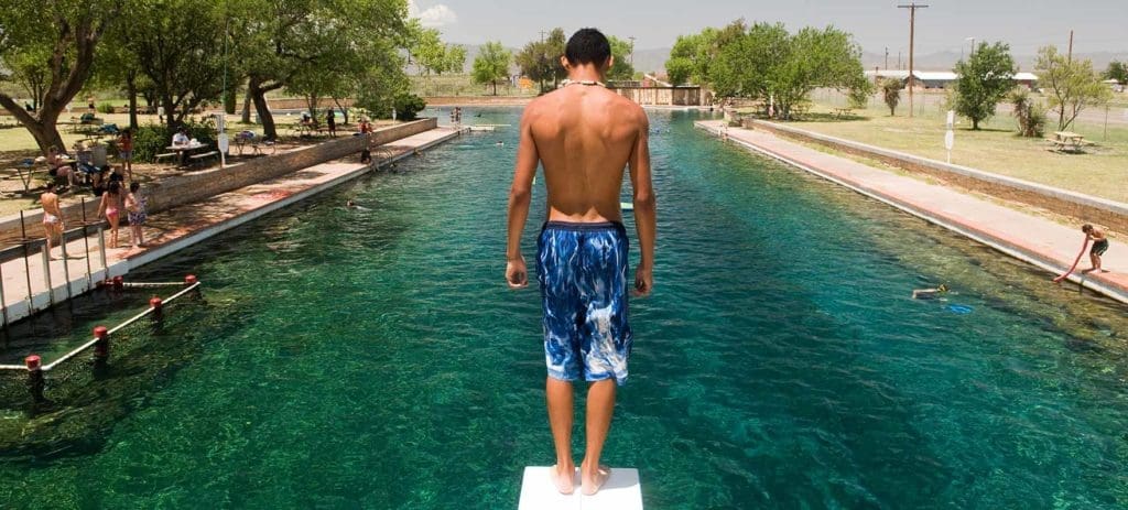 Landmark Texas Swimming Hole Endangered — and a Whiskey Distillery is Stepping Up to Help: Drinking Bourbon to Save One of the State’s Best Blue Retreats