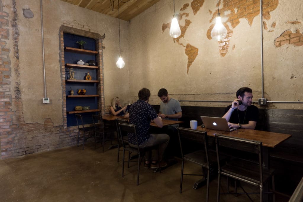 The team recycled elements from the original structure, such as reclaimed wood for chairs and tables.