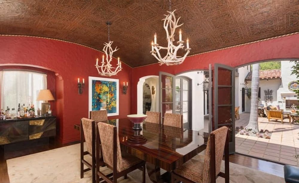 The antler chandeliers add an element of drama to the formal dining room. 