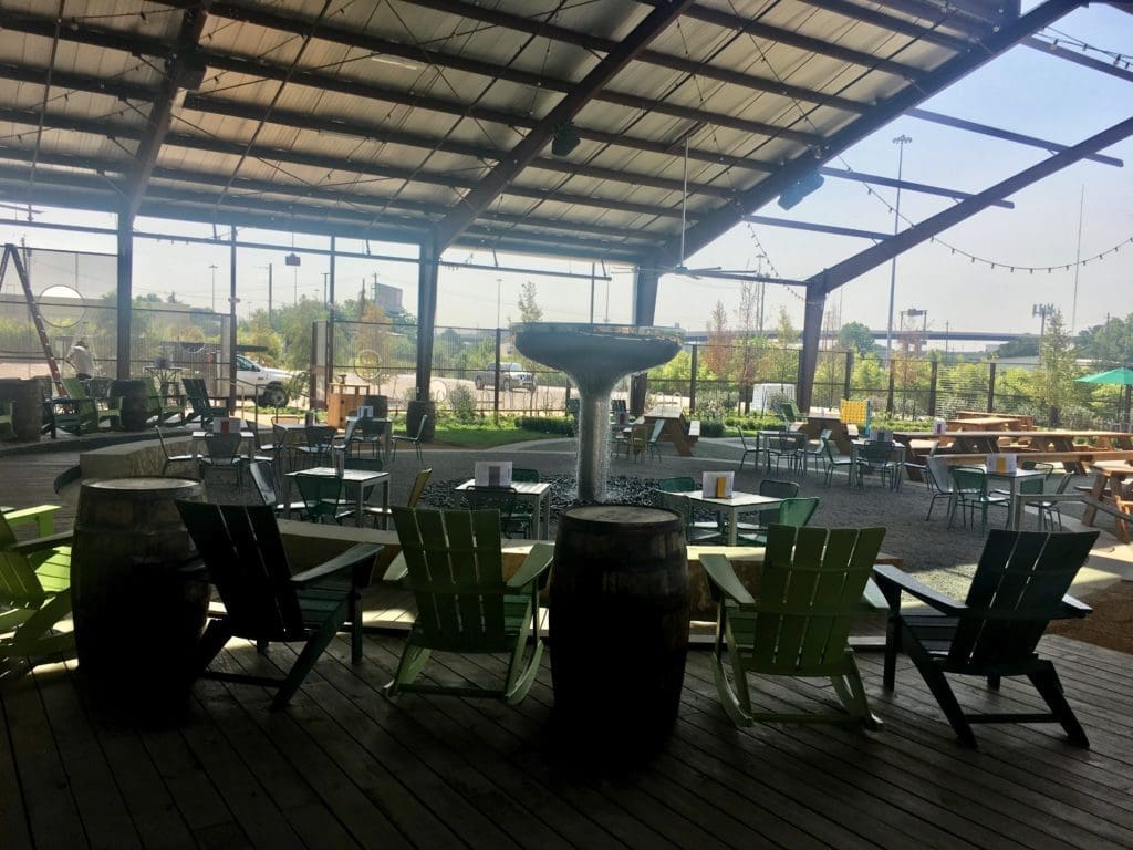 A kinetic water sculpture sits in the middle of the beer garden. 