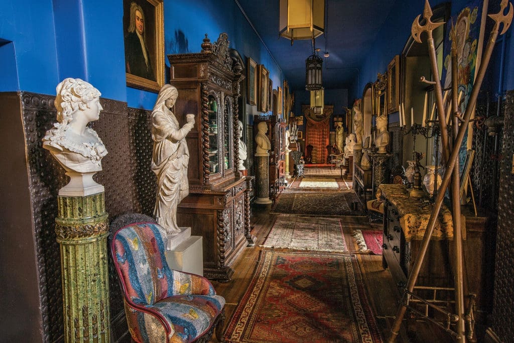 A riot of highly carved 19th-century furniture and busts hold court in the hallway. (Photo Chris Bolton)