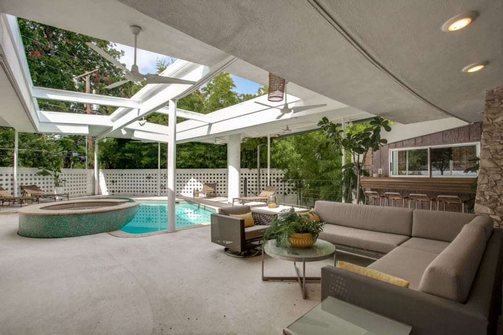 The covered patio is perfect for entertaining and has a bar. 