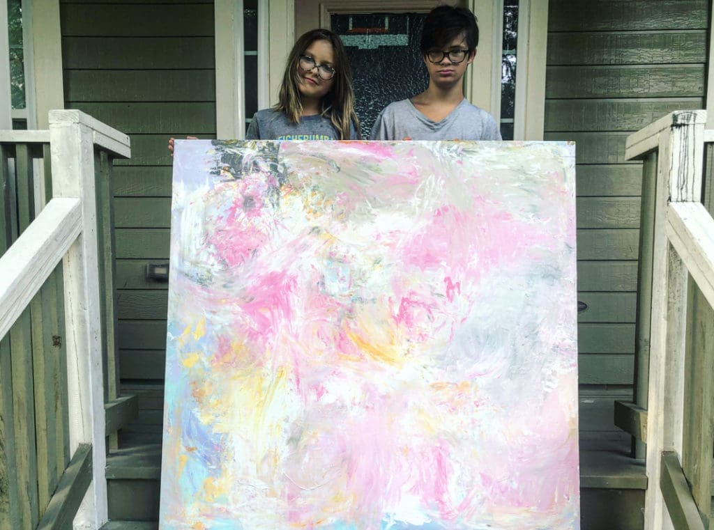 Ace and Archie pose with another large work from Sevy's second collection to show how big it actually is!