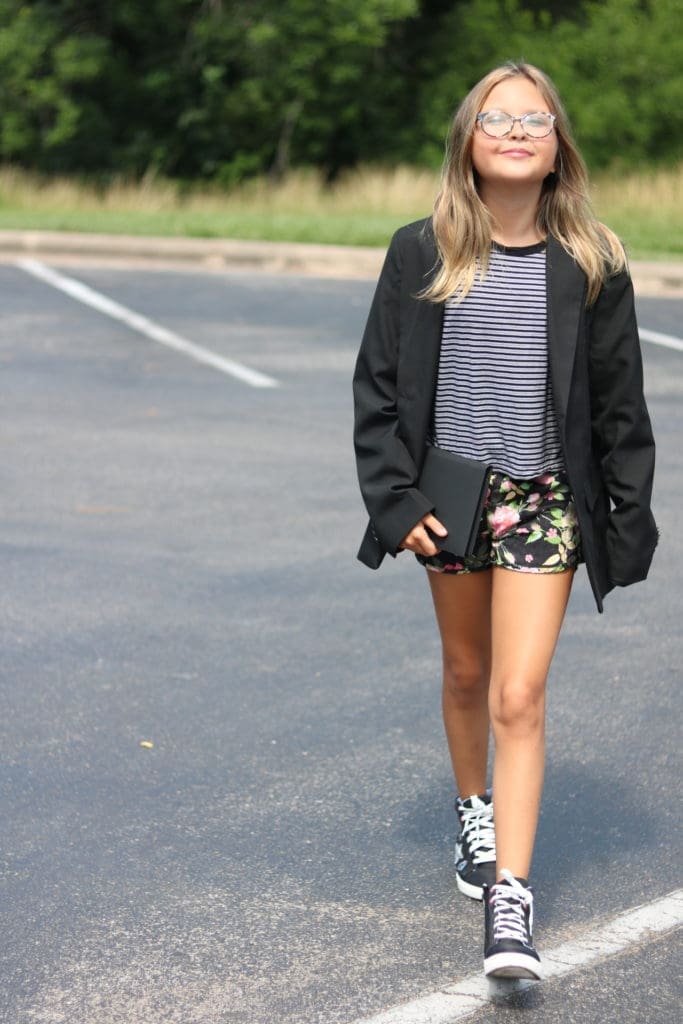 Ace walking out of her first big meeting for Sandal Gap Studios sporting an oversized blazer and the perfect amount of confidence.
