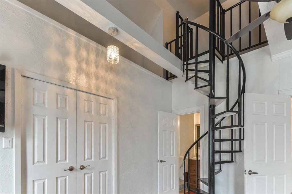 The spiral staircase leads to the loft. 