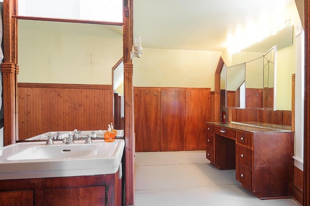 The mast bath features two sinks, storage and a mirrored vanity. 