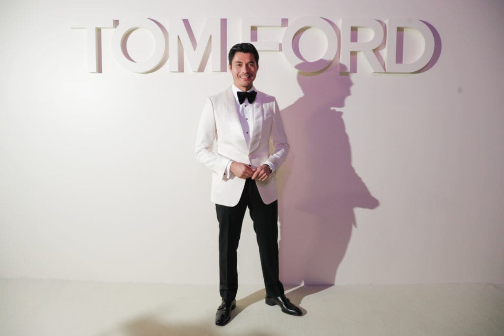 Celebrity Crowd Enjoys Tom Ford’s Kissing Booth at Fashion Week: Mischievous Designer Pulls Off a Sophisticated, Sexy Runway Show — and Henry Golding (and Others) Can’t Get Enough