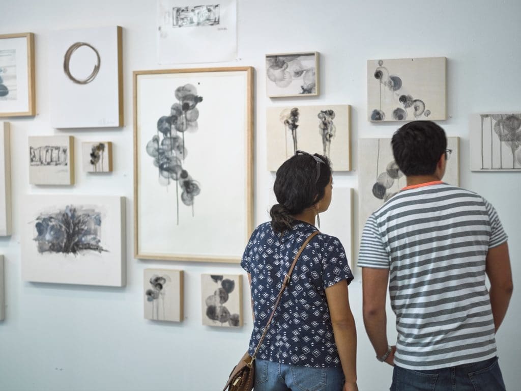 Studio-goers engage with Emily Dingmann's work in Winter Street, Studio #A1.