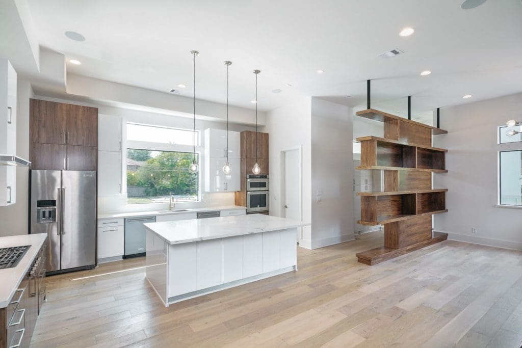 Innovative storage space separates the kitchen from the living room at 5003 Glenmeadow. 