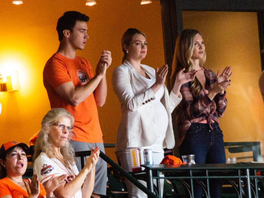 Rocking a white pantsuit, a pregnant Kate Upton watched her husband, Justin Verlander, dominate another postseason start in Game 1. (Photo by F. Carter Smith/PaperCity.)
