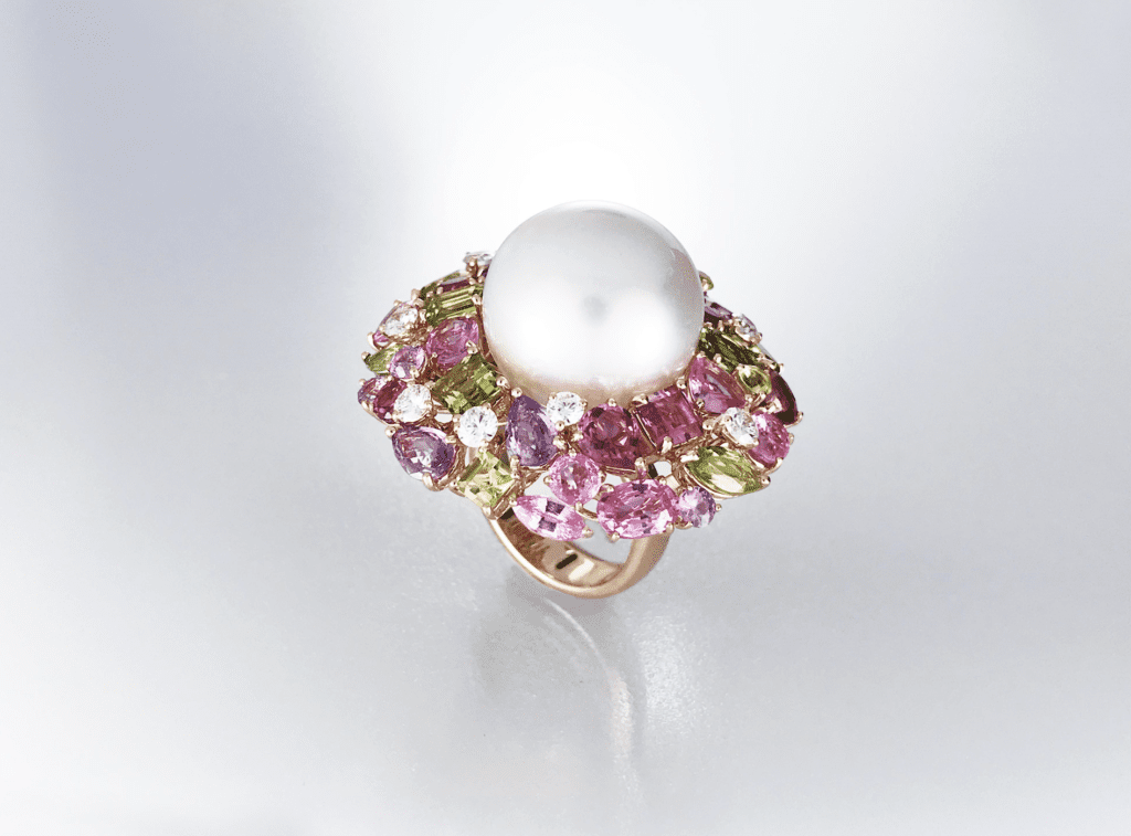 Australian South Sea Pearl cocktail ring surrounded by myriad of gemstones and diamonds in 18 karat yellow gold