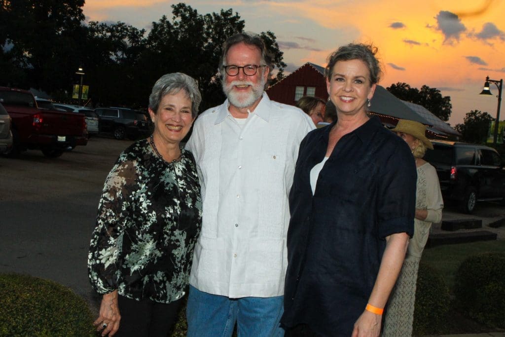 Artist Mary Quiros, Red & White Gallery's Jerry & Joan Herring. Quiros, a painter inspired by the beauty of nature, is among the talents featured in "10: The Red & White Gallery's Tenth Anniversary Exhibit." (Photo by Chris Pierre Bachman)