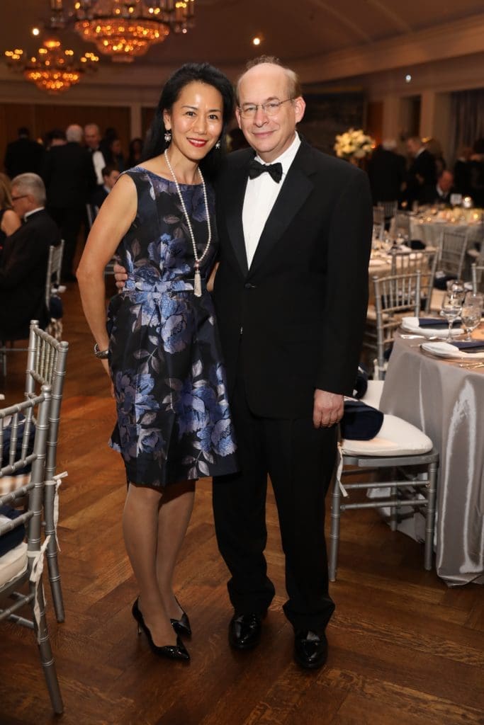 Rice University president David Leebron, seen here at a Rice fundraiser with his wife Y. Ping Sun, is in the media spotlight over the university's response to the need for social distancing.