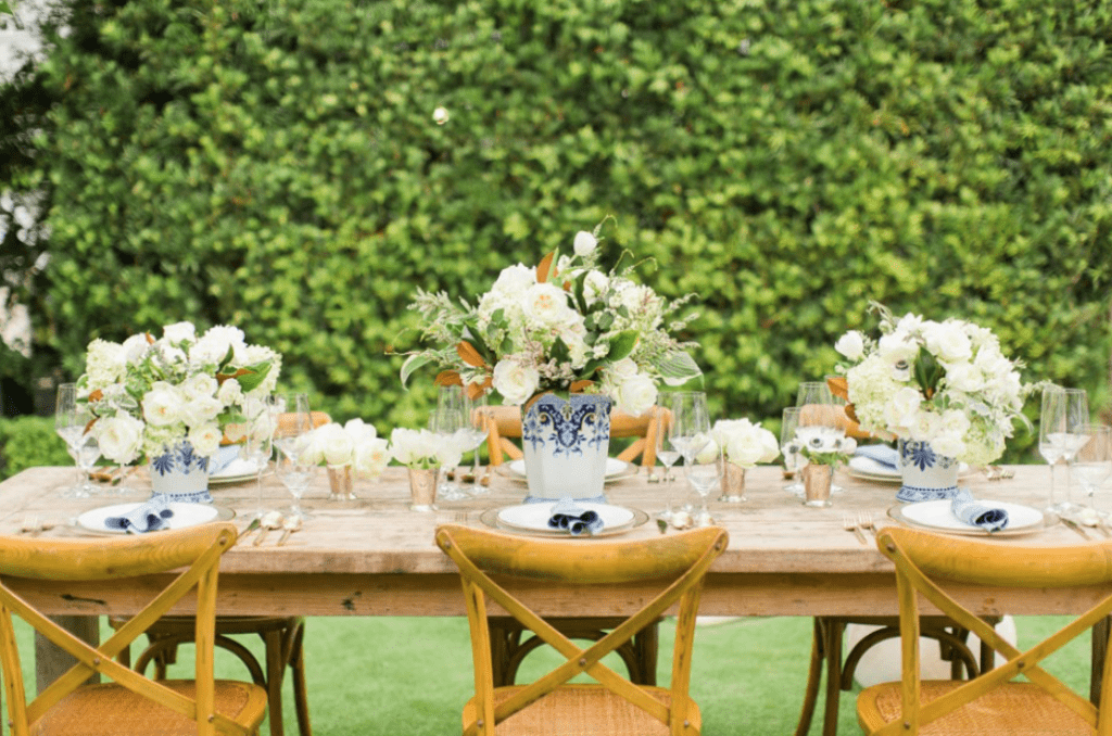 Tiny Boxwoods's garden enjoys California vibes, perfect for outdoor dining.