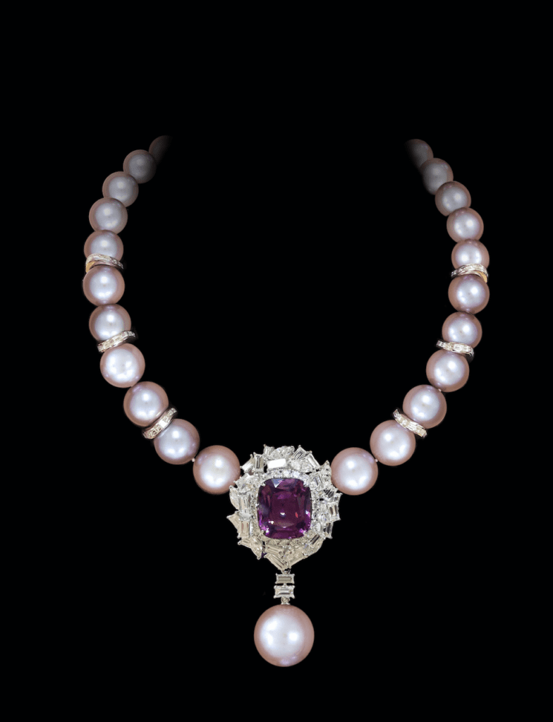 Stunning pink spinel and diamond pendant suspended from a natural coloured pink pearl strand accented with diamond rondelles on 18 karat white gold