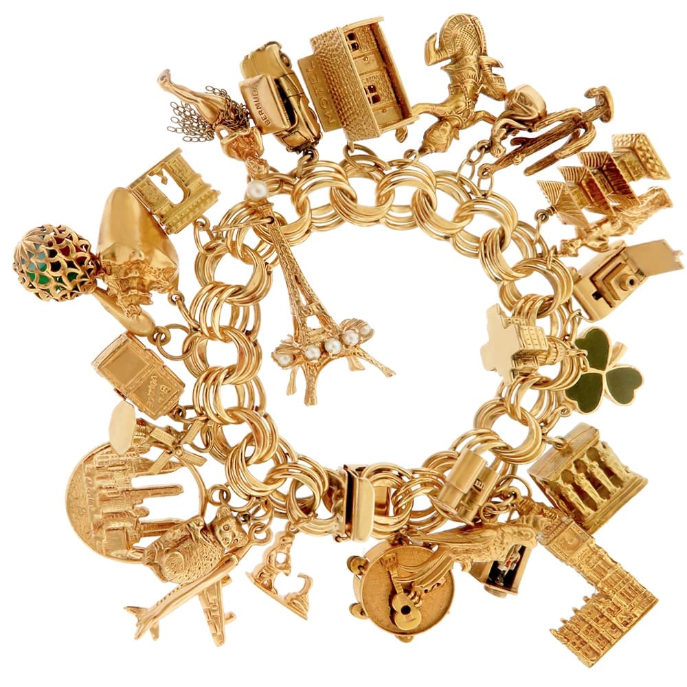 Travel charms, vintage and new, on a classic triple link bracelet 