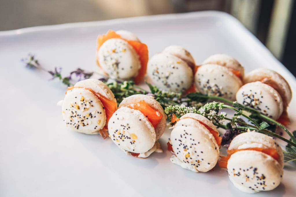 Wolfgang Puck flipped the switch on the macaron with a savory take, featuring house-smoked salmon and chive crème fraîche