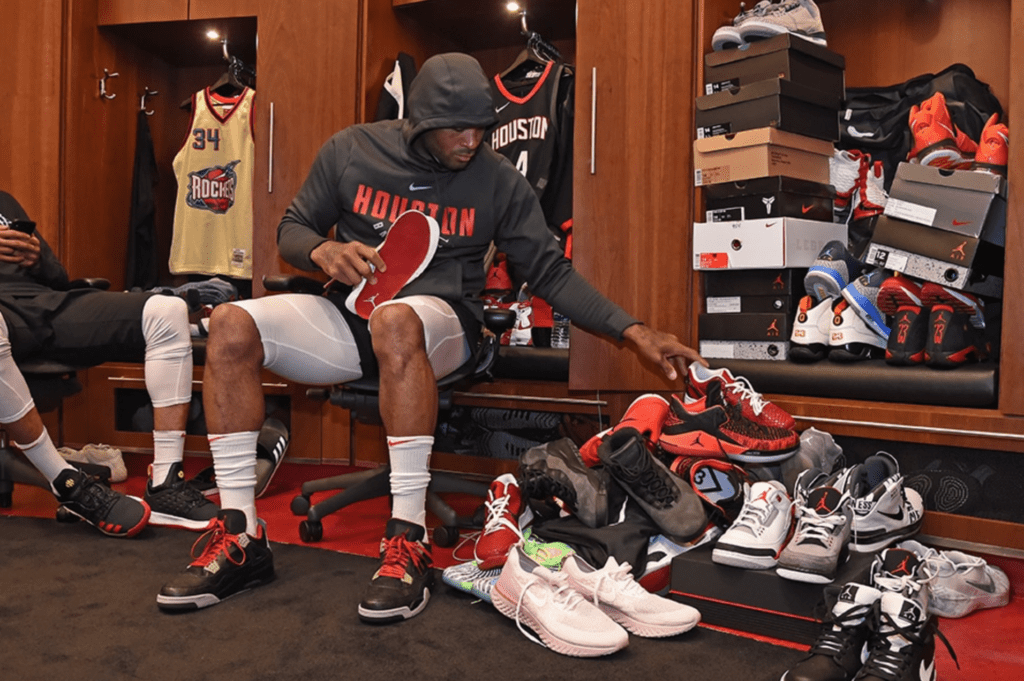 In the Rockets locker room, P.J. Tucker goes through his collection of sneakers.