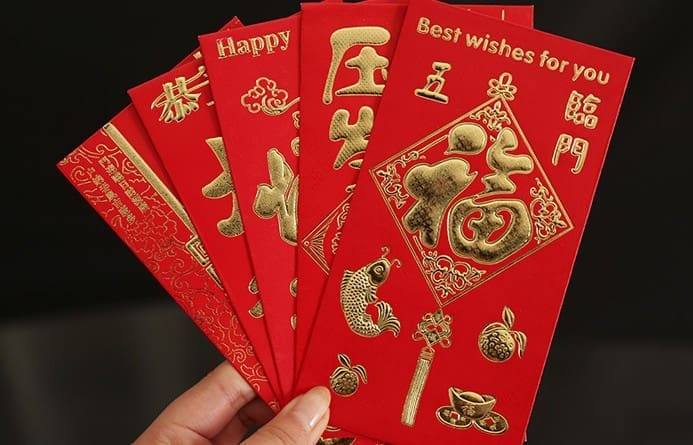 Chinese New Year means red envelopes — and you'll be lucky to get one.