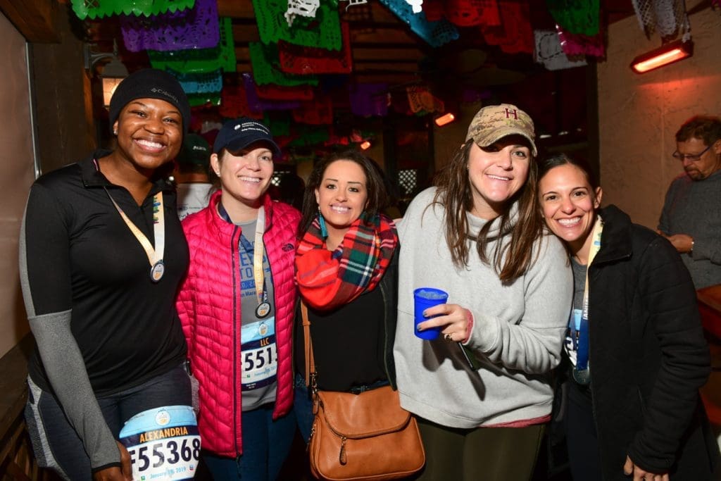 Houston Marathon Runners Celebrate With Champagne After Enduring the Chill