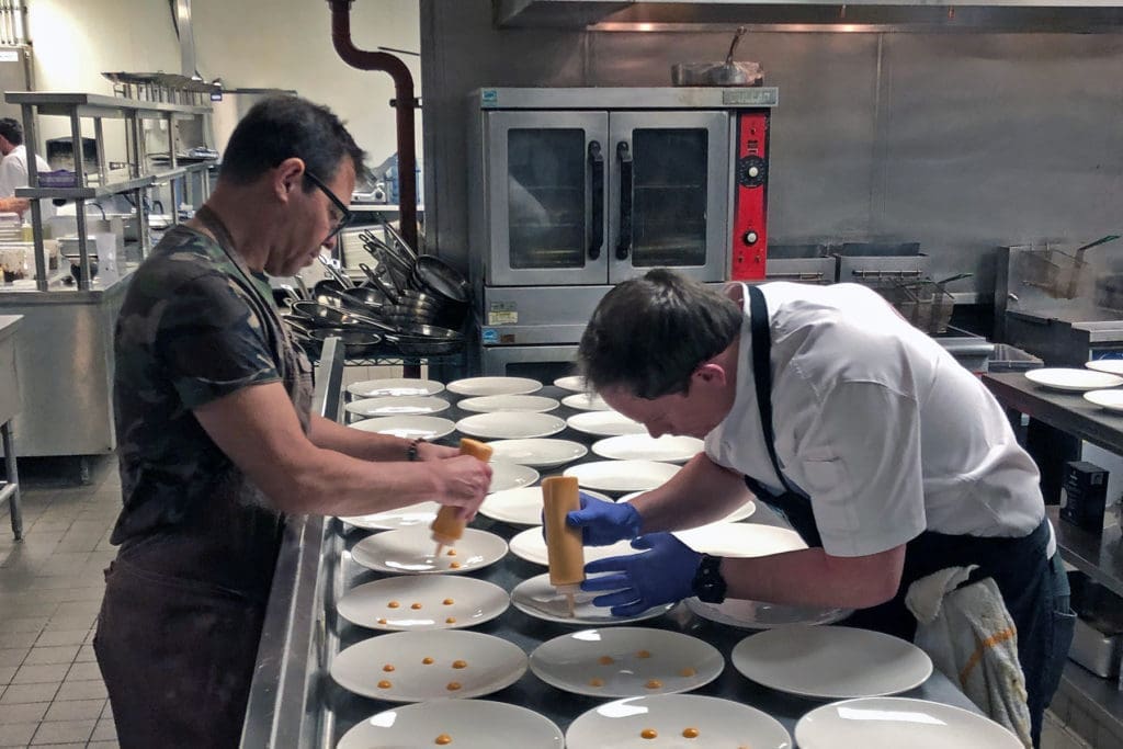 Together again: Dallas chef John Tesar partners with Tris chef Austin Simmons in Simmons' kitchen in The Woodlands.