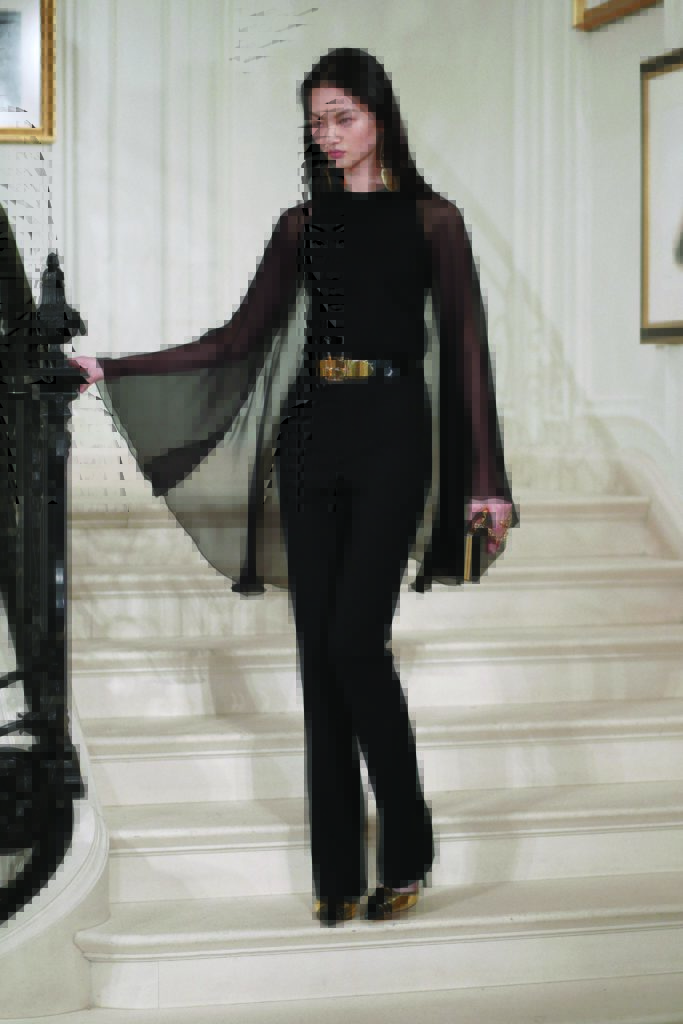 Ralph Lauren black long-sleeve crewneck cape sweater
in black wool crepe, straight-leg pant. Photo by  (Photo by Courtesy of Ralph Lauren)