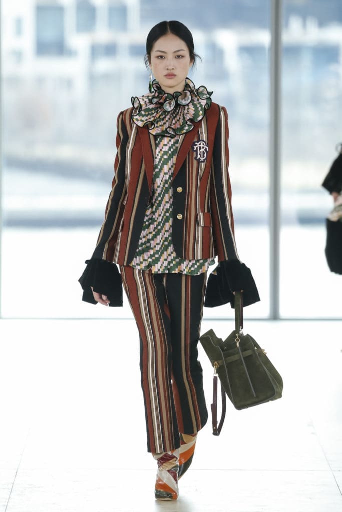 Tory Burch striped wool blazer with TB logo and wool pant, geo-print satin top (Photo by Tory Burch)