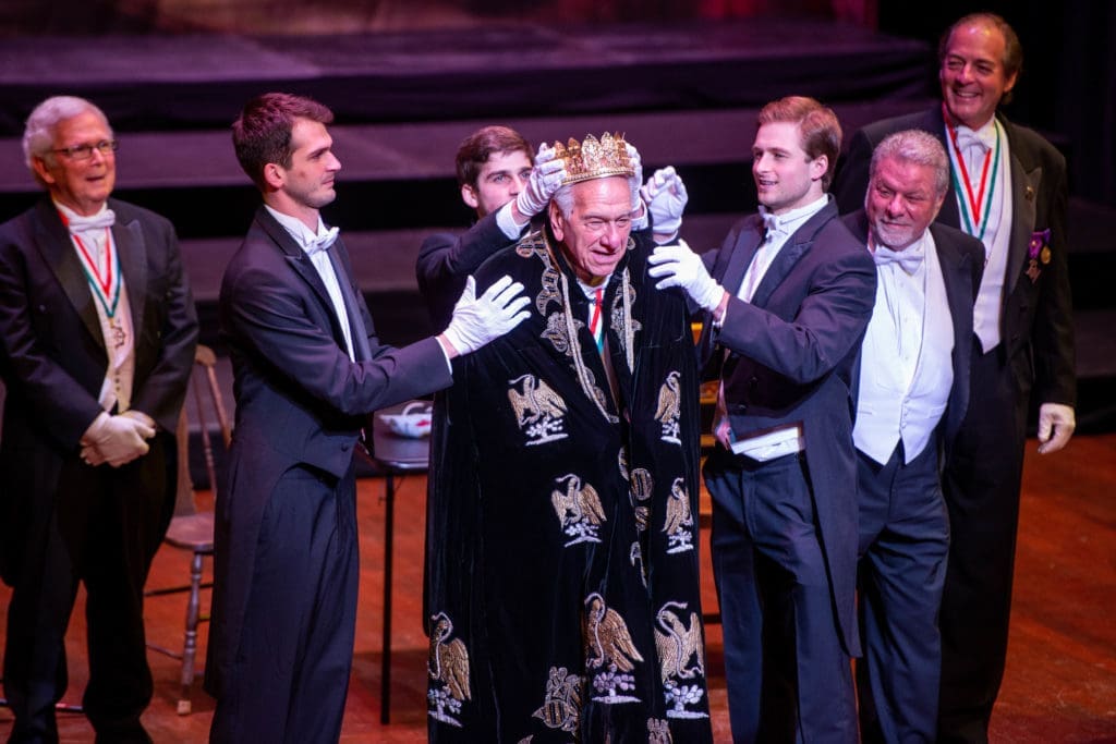 King Frivolous Vic Fertitta is crowned by his grandsons Michael, Blake and Patrick  at the Knights of Momus Fiesta de Momus at The Grand 1894 Opera House in Galveston.(Photo by Michelle Watson/CatchlightGroup.com)