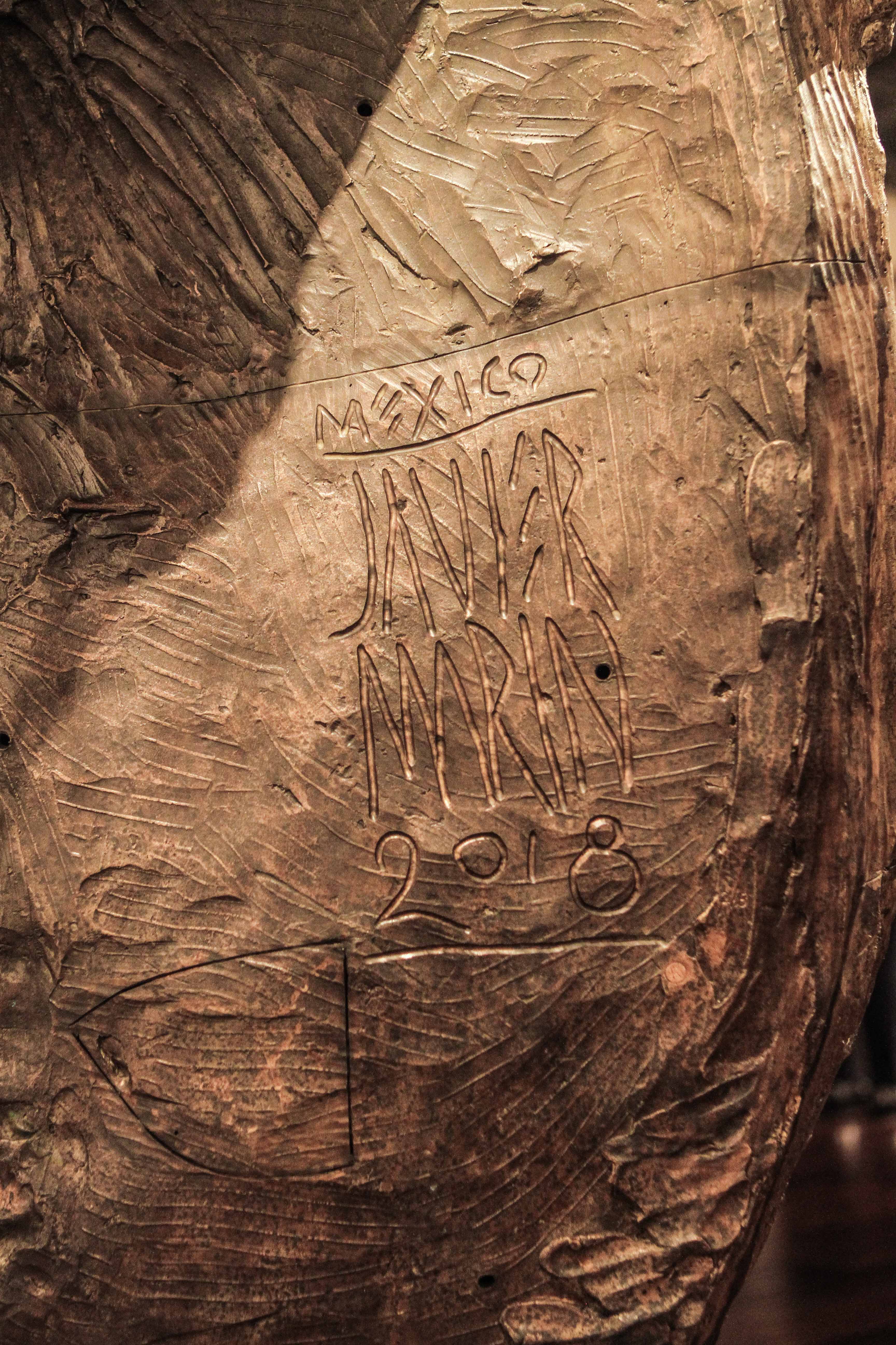 The sculptor's distinctive signature (Photo by Chris P. Bachman)