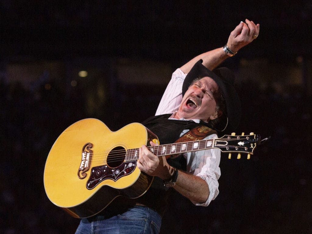 Kix Brooks is what you'd call a showman.  Ronnie Dunn rocked out.  (Photo by F. Carter Smith)